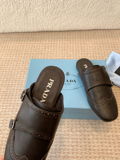PRADA DOUBLE MONK MULES IN WALNUT BROWN CALFSKIN