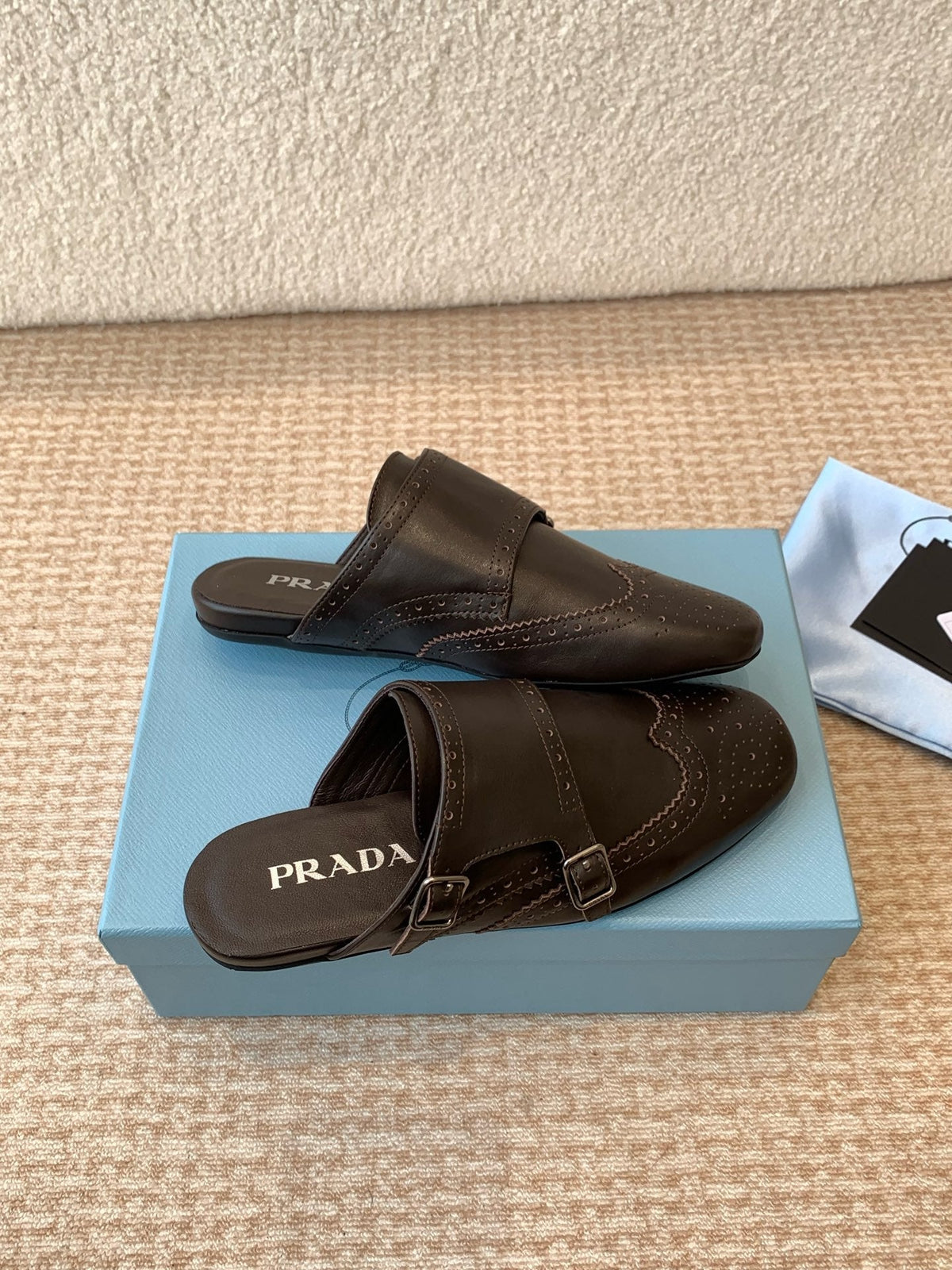 PRADA DOUBLE MONK MULES IN WALNUT BROWN CALFSKIN