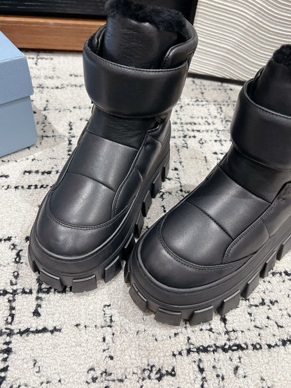 PRADA MONOLITH ANKLE BOOTS WITH STRAP IN BLACK CALFSKIN AND FLEECE LINING