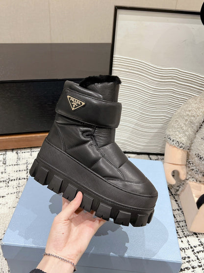 PRADA MONOLITH ANKLE BOOTS WITH STRAP IN BLACK CALFSKIN AND FLEECE LINING