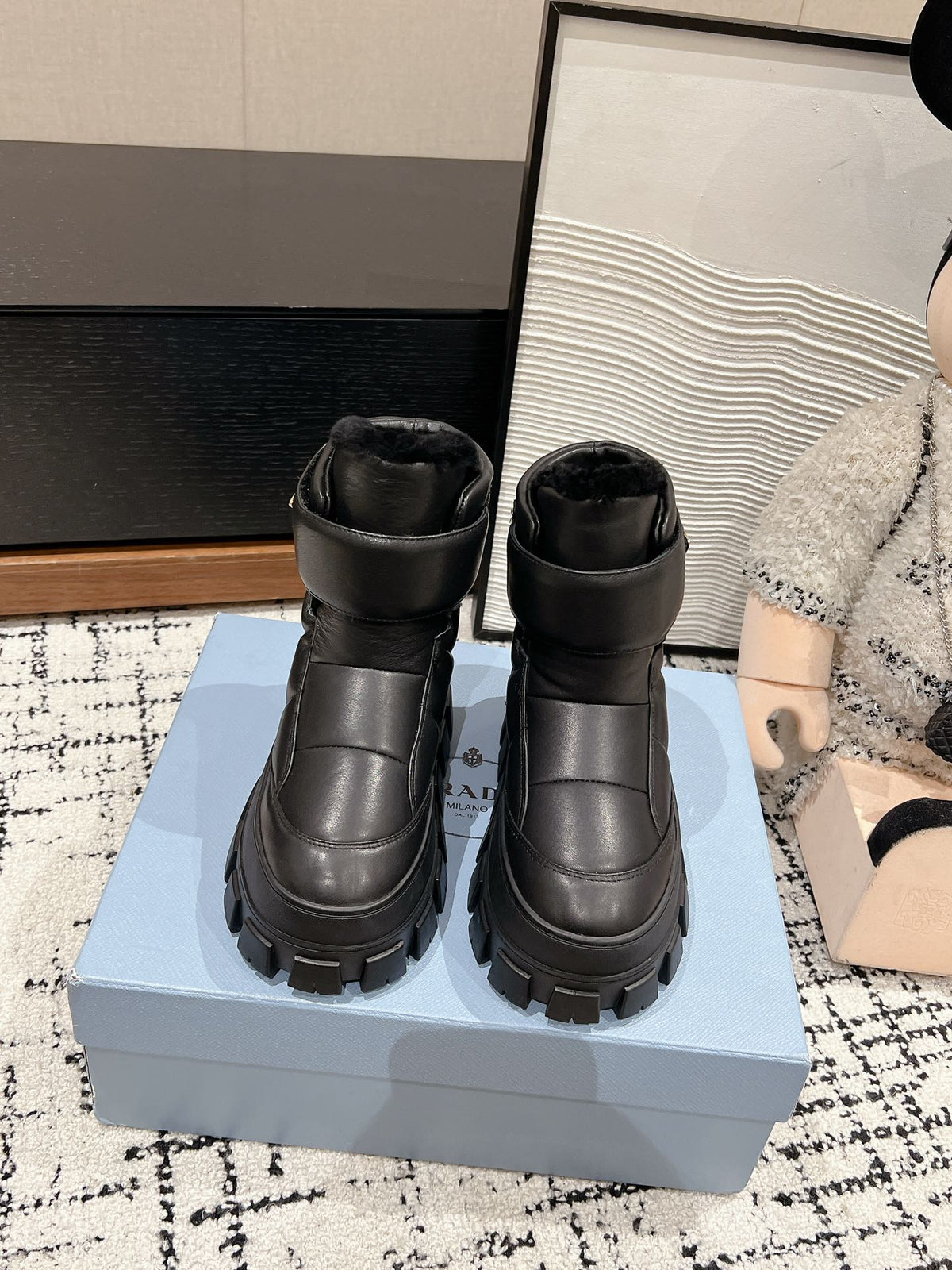 PRADA MONOLITH ANKLE BOOTS WITH STRAP IN BLACK CALFSKIN AND FLEECE LINING