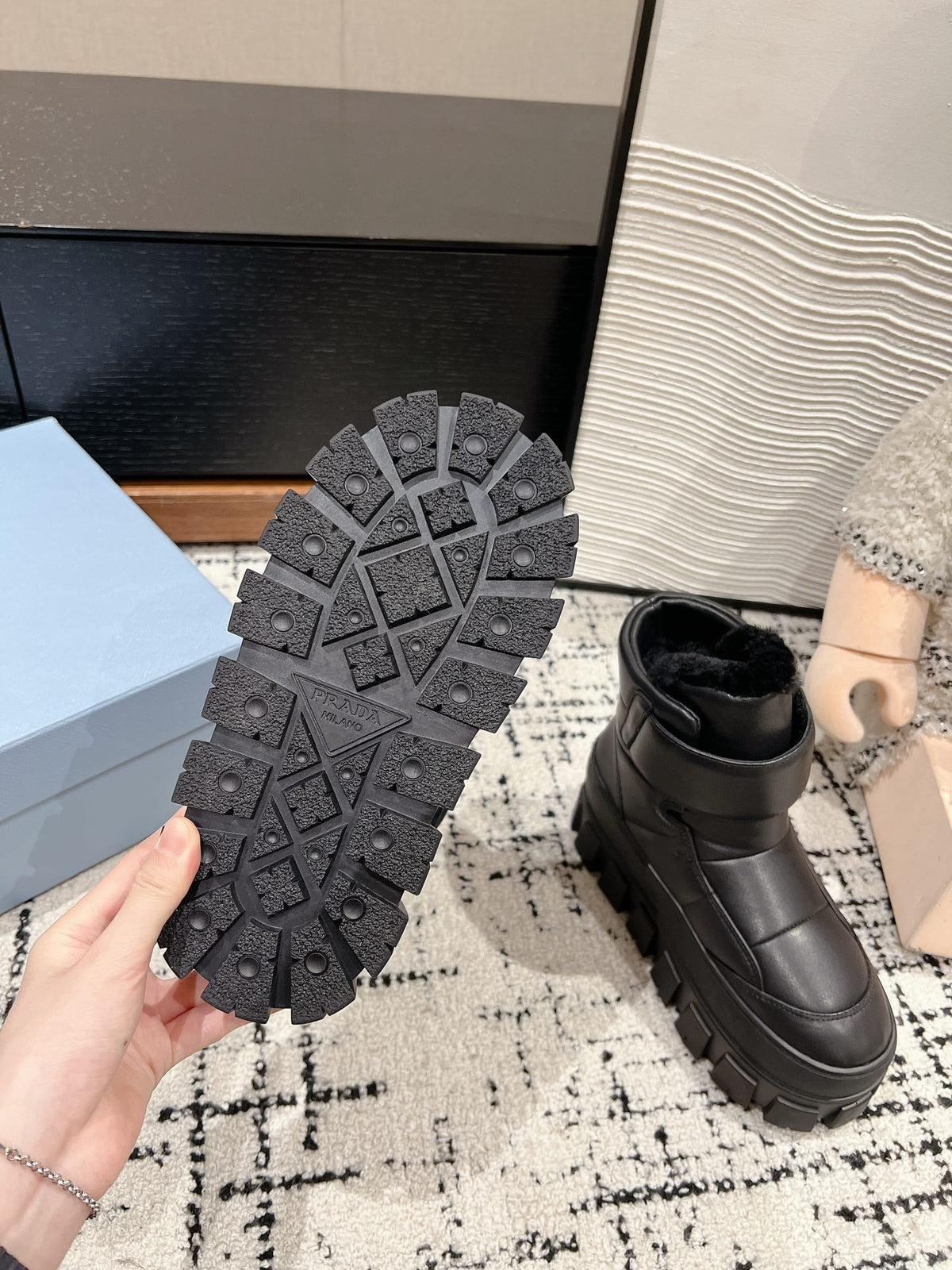 PRADA MONOLITH ANKLE BOOTS WITH STRAP IN BLACK CALFSKIN AND FLEECE LINING