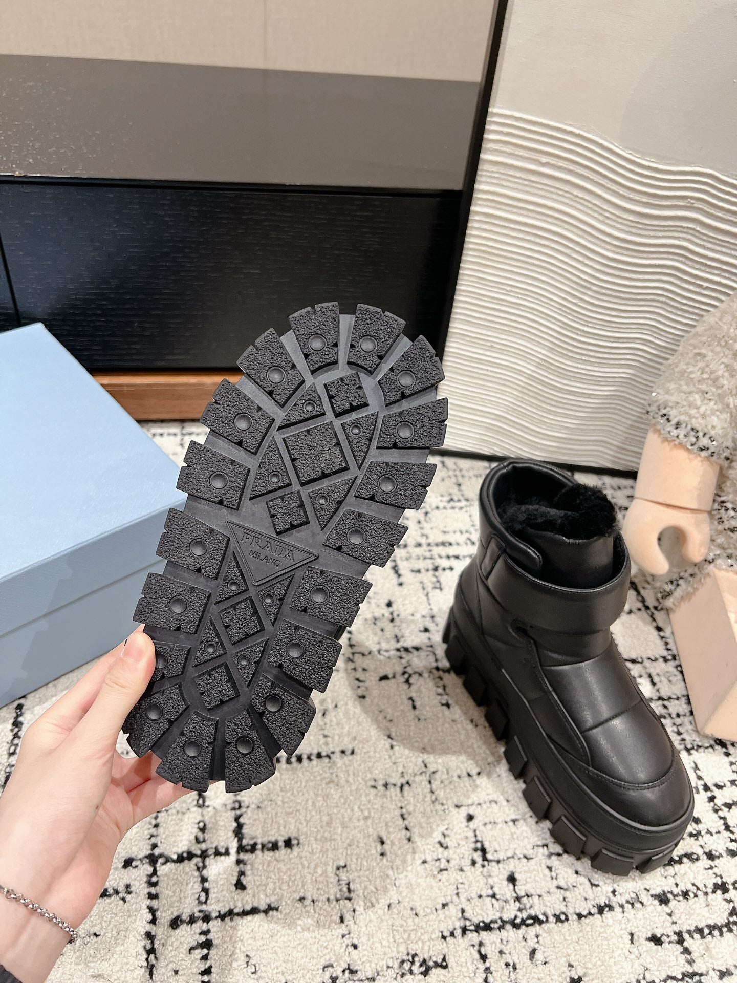 PRADA MONOLITH ANKLE BOOTS WITH STRAP IN BLACK CALFSKIN AND FLEECE LINING