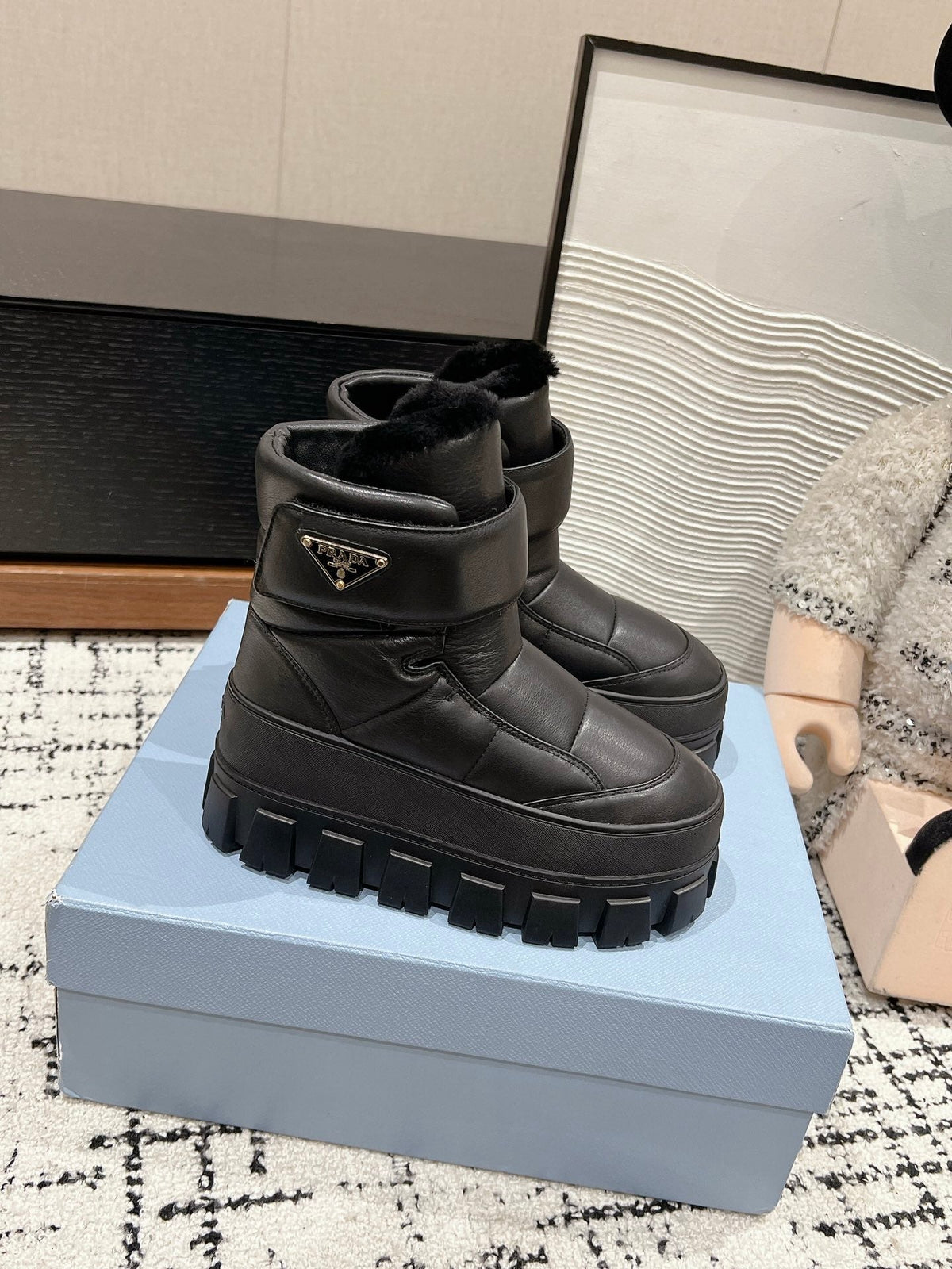 PRADA MONOLITH ANKLE BOOTS WITH STRAP IN BLACK CALFSKIN AND FLEECE LINING