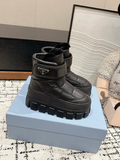 PRADA MONOLITH ANKLE BOOTS WITH STRAP IN BLACK CALFSKIN AND FLEECE LINING