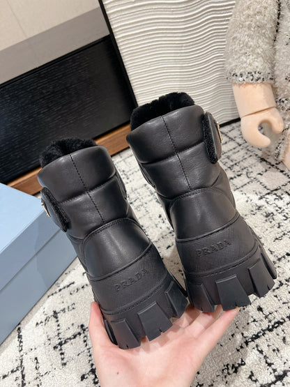 PRADA MONOLITH ANKLE BOOTS WITH STRAP IN BLACK CALFSKIN AND FLEECE LINING