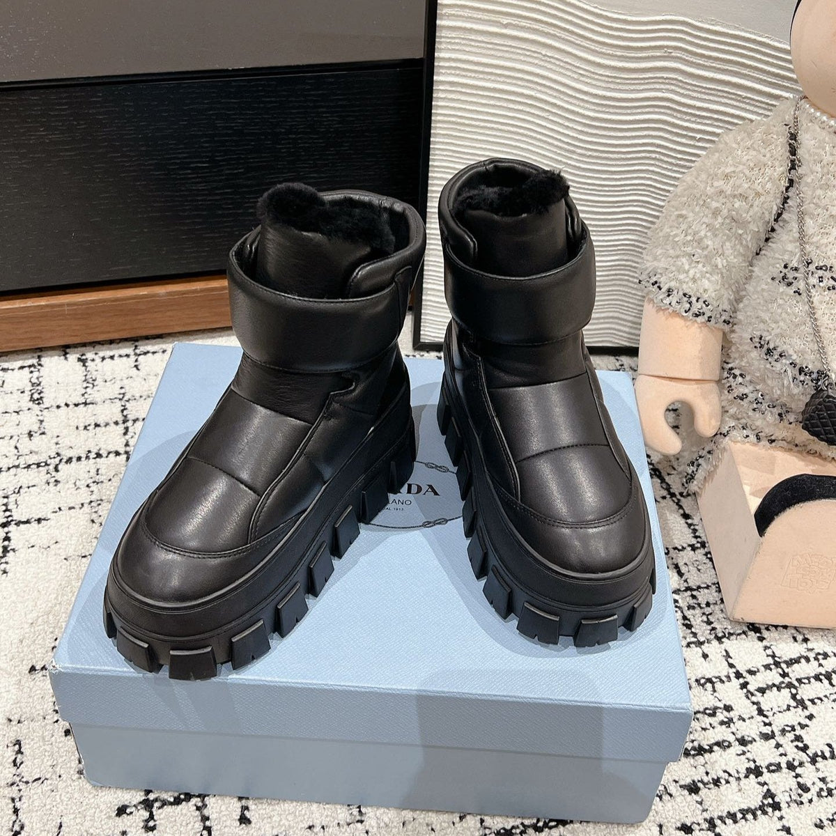 PRADA MONOLITH ANKLE BOOTS WITH STRAP IN BLACK CALFSKIN AND FLEECE LINING