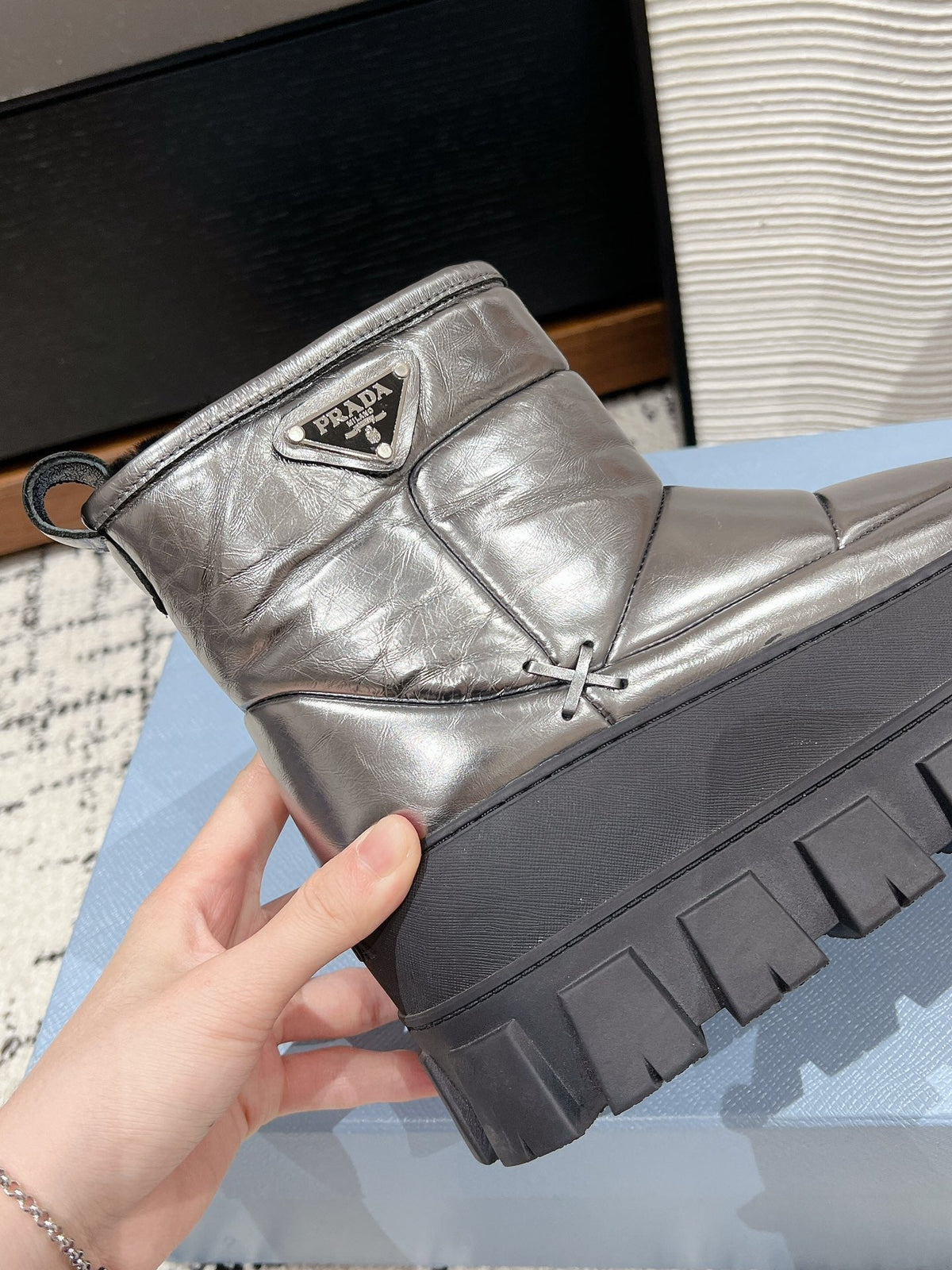 PRADA MONOLITH ANKLE BOOTS IN METALLIC GRAY CALFSKIN AND LAMB FUR LINING