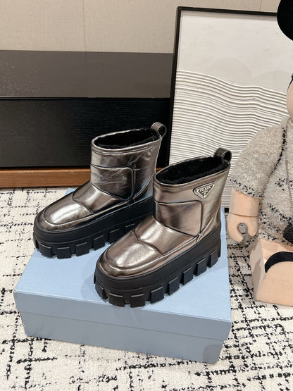 PRADA MONOLITH ANKLE BOOTS IN METALLIC GRAY CALFSKIN AND LAMB FUR LINING