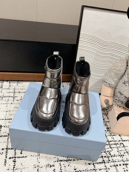 PRADA MONOLITH ANKLE BOOTS IN METALLIC GRAY CALFSKIN AND LAMB FUR LINING