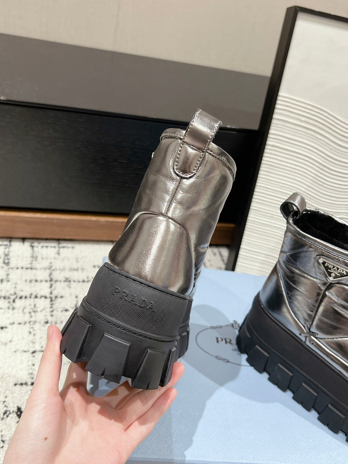 PRADA MONOLITH ANKLE BOOTS IN METALLIC GRAY CALFSKIN AND LAMB FUR LINING