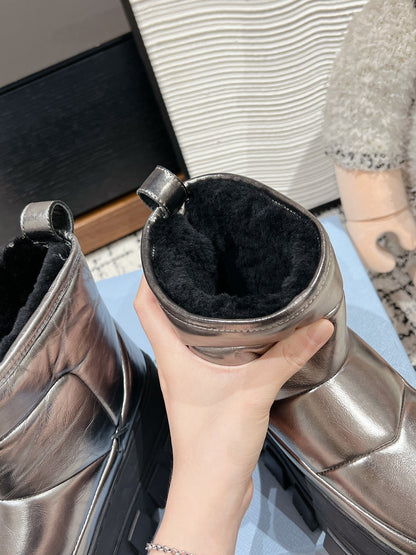 PRADA MONOLITH ANKLE BOOTS IN METALLIC GRAY CALFSKIN AND LAMB FUR LINING