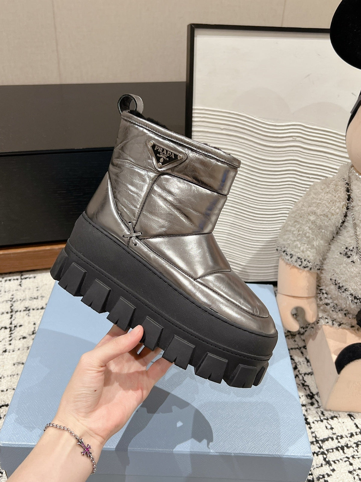 PRADA MONOLITH ANKLE BOOTS IN METALLIC GRAY CALFSKIN AND LAMB FUR LINING