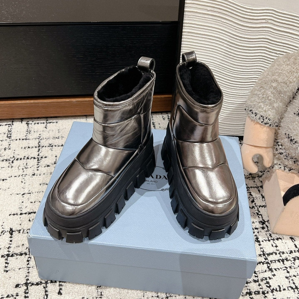 PRADA MONOLITH ANKLE BOOTS IN METALLIC GRAY CALFSKIN AND LAMB FUR LINING