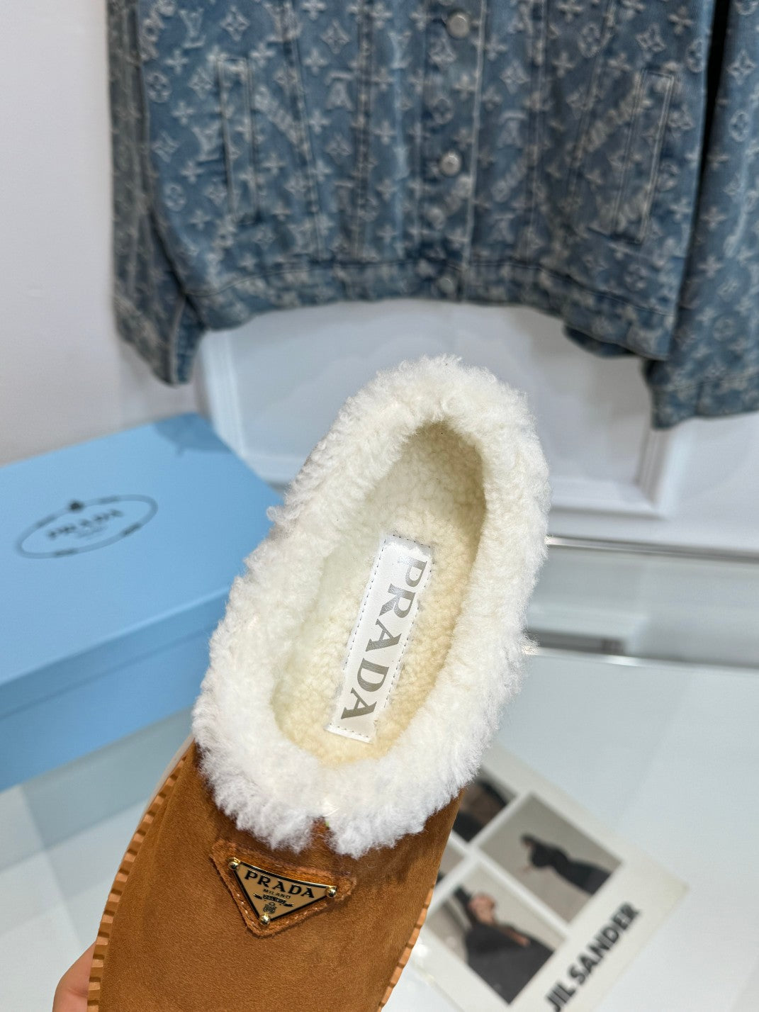 PRADA TRIANGLE LOGO MULES IN BRONZE BROWN SUEDE AND SHEARLING LINING