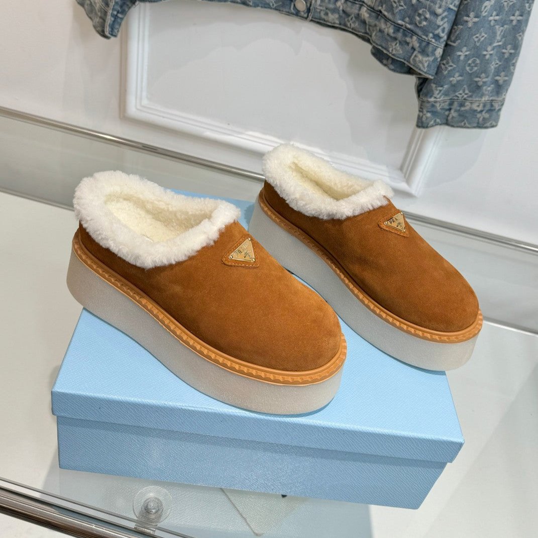 PRADA TRIANGLE LOGO MULES IN BRONZE BROWN SUEDE AND SHEARLING LINING