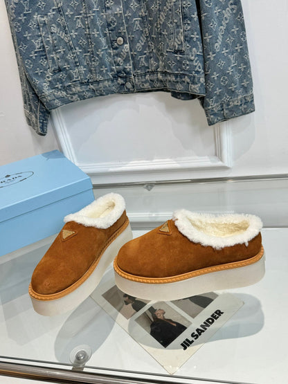 PRADA TRIANGLE LOGO MULES IN BRONZE BROWN SUEDE AND SHEARLING LINING