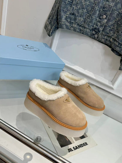 PRADA TRIANGLE LOGO MULES IN BEIGE SUEDE AND SHEARLING LINING