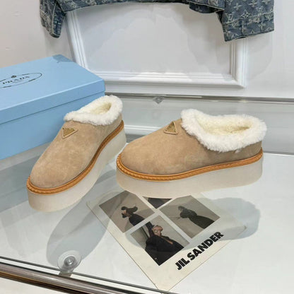 PRADA TRIANGLE LOGO MULES IN BEIGE SUEDE AND SHEARLING LINING