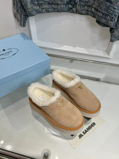 PRADA TRIANGLE LOGO MULES IN BEIGE SUEDE AND SHEARLING LINING