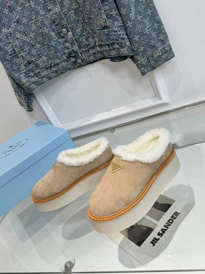 PRADA TRIANGLE LOGO MULES IN BEIGE SUEDE AND SHEARLING LINING