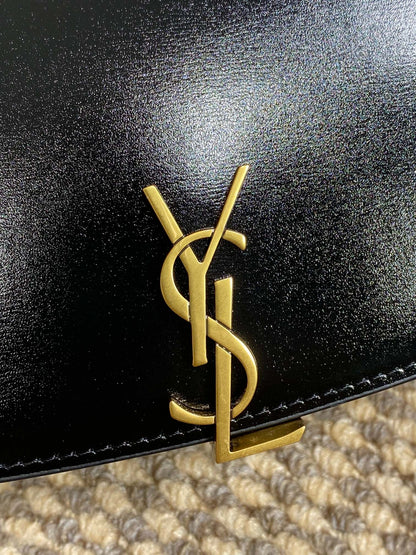 SAINT LAURENT VOLTAIRE HALF-MOON SHOULDER BAG 24 IN BLACK CALFSKIN GOLD METALLIC