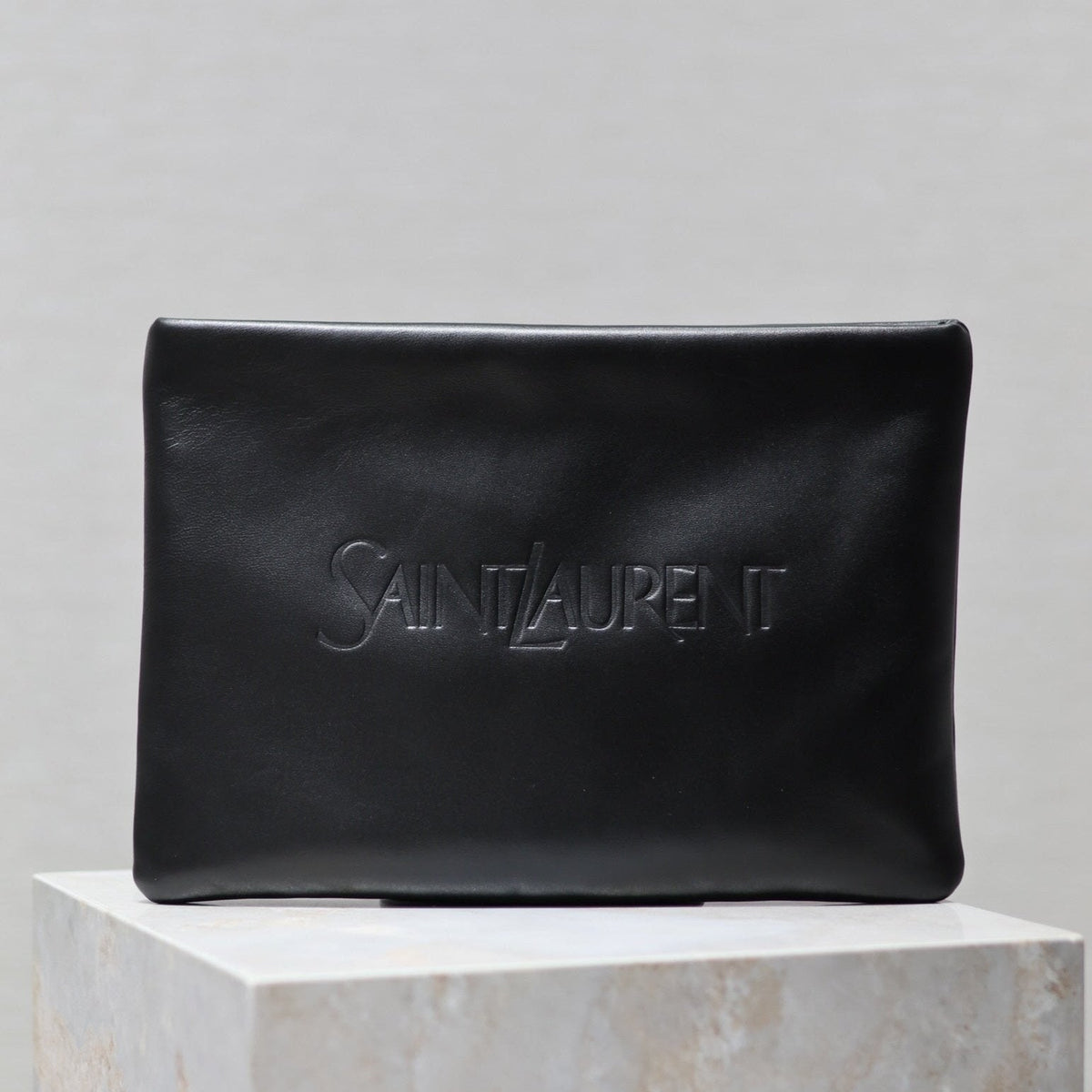 SAINT LAURENT POUCH 30 IN BLACK CALFSKIN WITH EMBOSSED LOGO