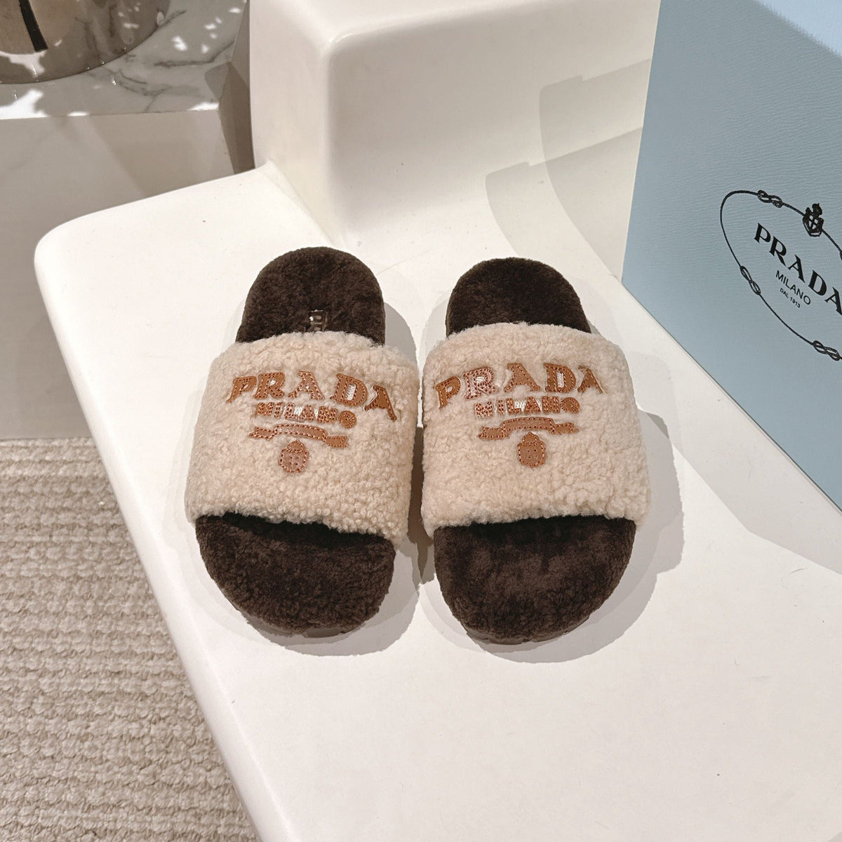 PRADA 25S FLAT MULES IN CREAM AND RK BROWN RABBIT FUR
