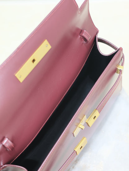 SAINT LAURENT MANHATTAN MEDIUM 29 IN WINE RED SMOOTH CALFSKIN GOLD BUCKLE