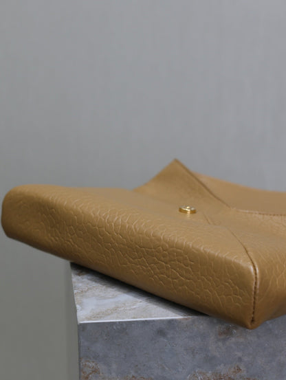 SAINT LAURENT ENVELOPE CLUTCH 29 IN EARTHY YELLOW LAMBSKIN COPPER LOGO