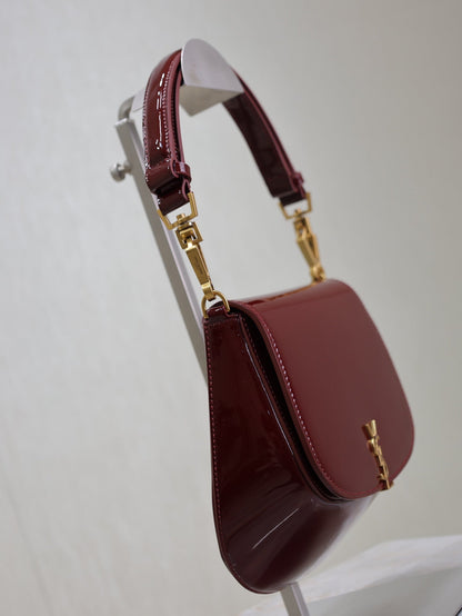 SAINT LAURENT VOLTAIRE SADDLE BAG 21 IN BORDEAUX RED PATENT CALFSKIN